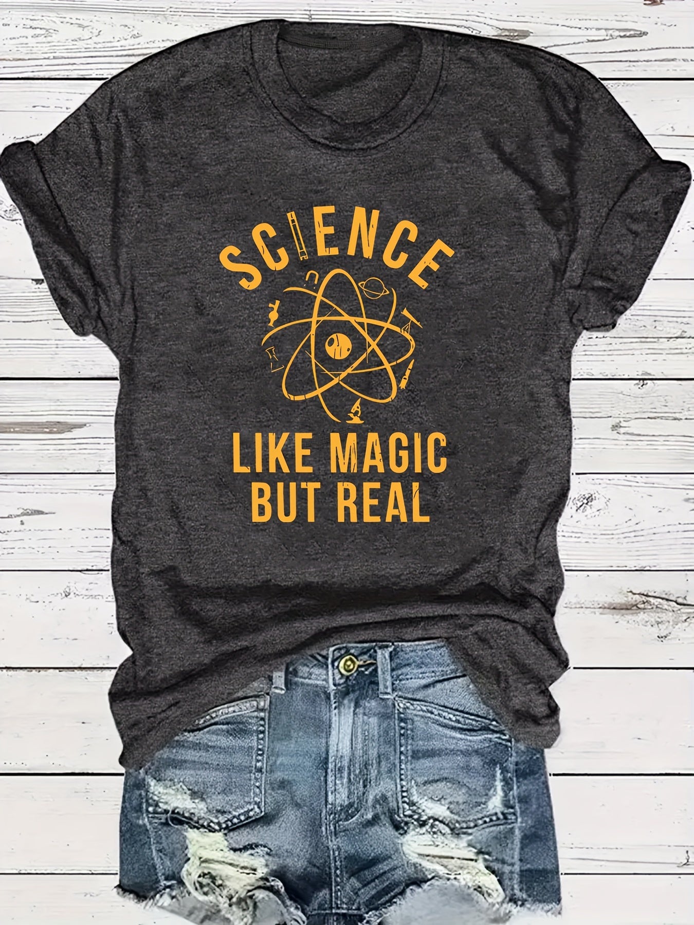[Science Tee] Dark Grey Women's Science Print T-Shirt | Short Sleeve Crew Neck Casual Top | Machine Washable Summer & Spring Apparel, Science Shirt, Casual Attire, Playful Graphic Tee, Relaxed Fit Shirt - "Science Like Magic But Real" Atomic Graphic